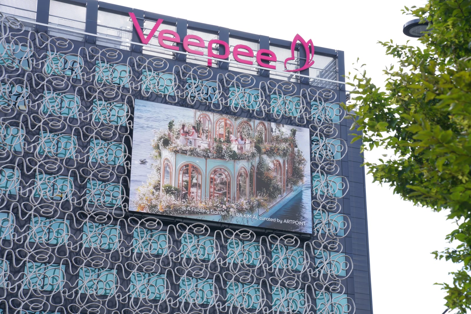 Hera Kim’s floral architecture displayed on the VEEPEE building screen